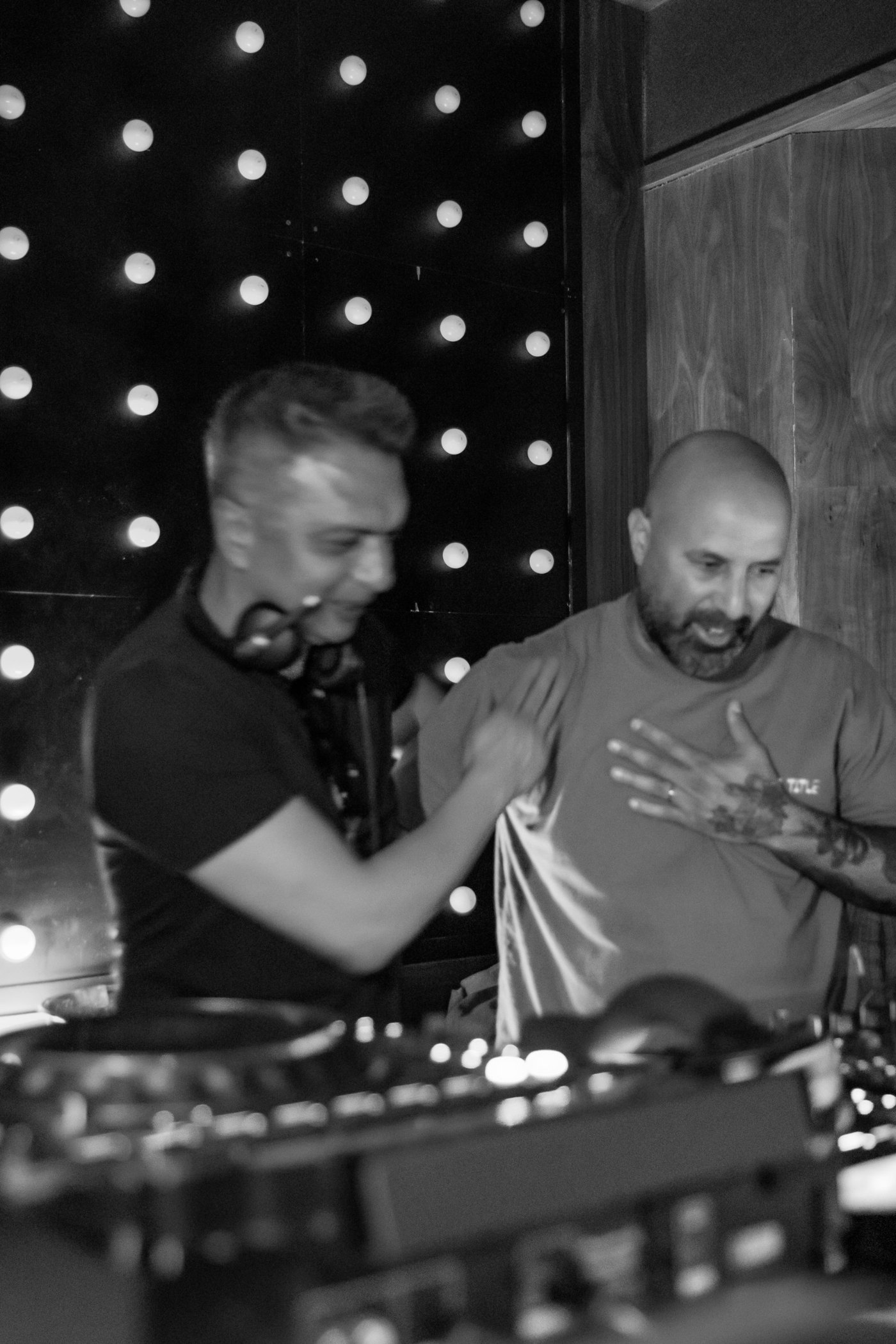 Secr3t Key and Tomer laughing together behind the decks at Jolene Sound Room