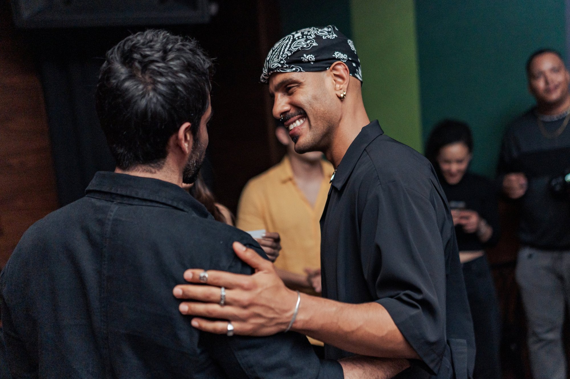 Two guests greeting each other on the floor at Jolene Sound Room