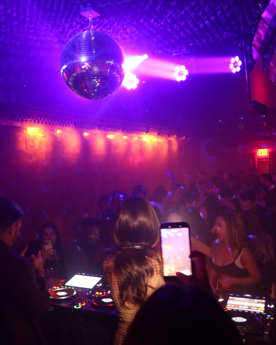Hermina playing to a packed room under the disco ball at Maison Nur